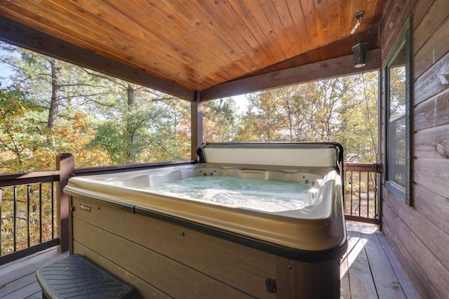 deck featuring a hot tub