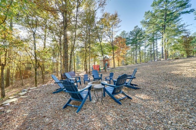 view of yard with an outdoor fire pit