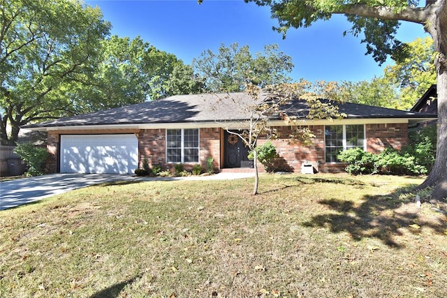 ranch-style house featuring a garage and a front lawn