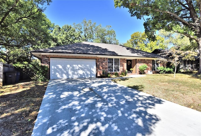 ranch-style house with a garage and a front lawn