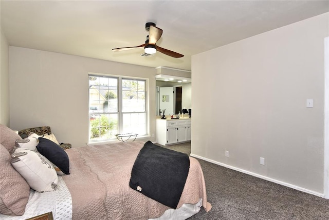 bedroom with ceiling fan, carpet floors, and ensuite bathroom