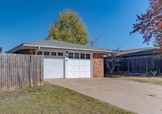 garage featuring a lawn