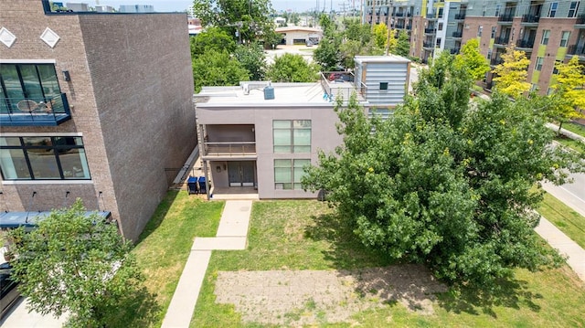 entrance to property with a lawn