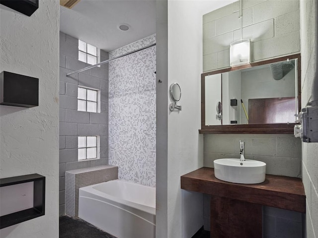 bathroom with sink and backsplash