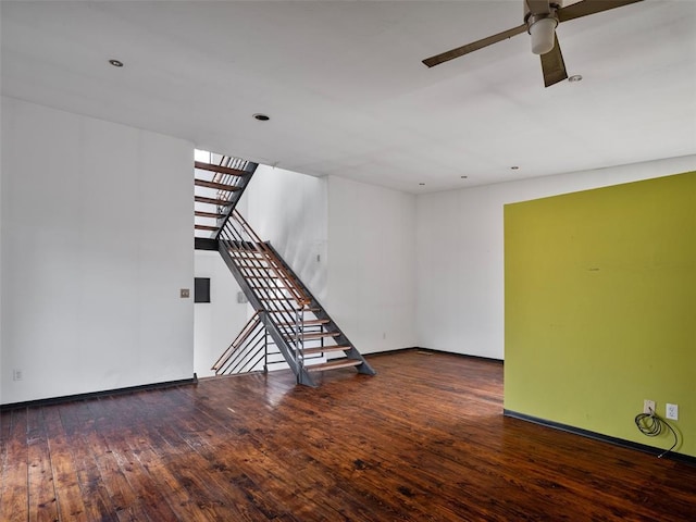 unfurnished living room with hardwood / wood-style flooring and ceiling fan