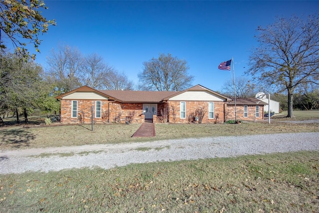 ranch-style house with a front lawn