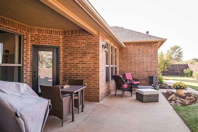 view of patio featuring fence