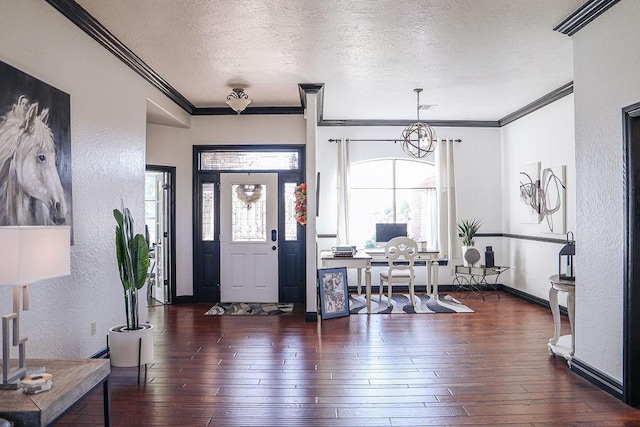 foyer entrance featuring a textured wall and hardwood / wood-style flooring