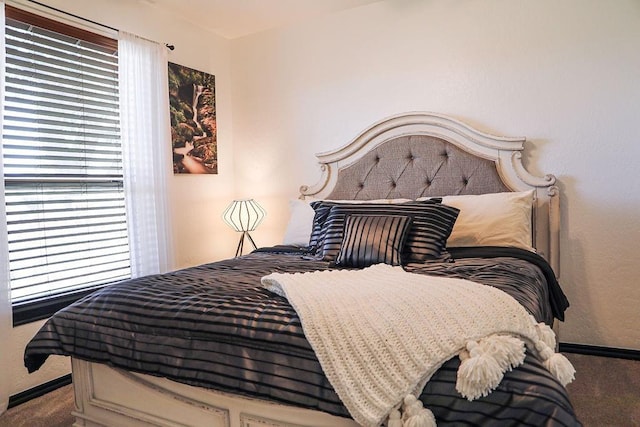 carpeted bedroom with baseboards