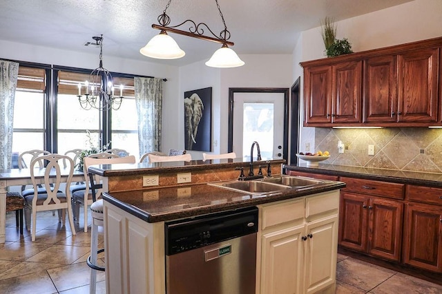 kitchen featuring a sink, stainless steel dishwasher, hanging light fixtures, decorative backsplash, and an inviting chandelier