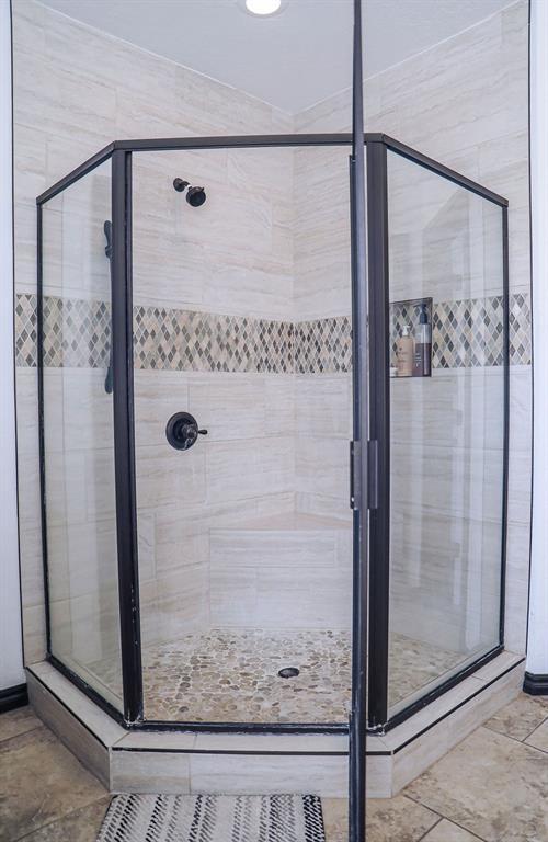 bathroom with a shower stall