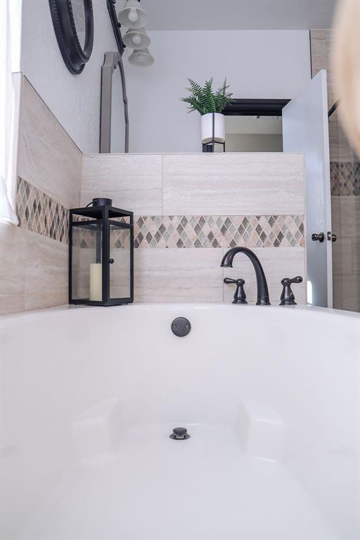 bathroom with a bathing tub