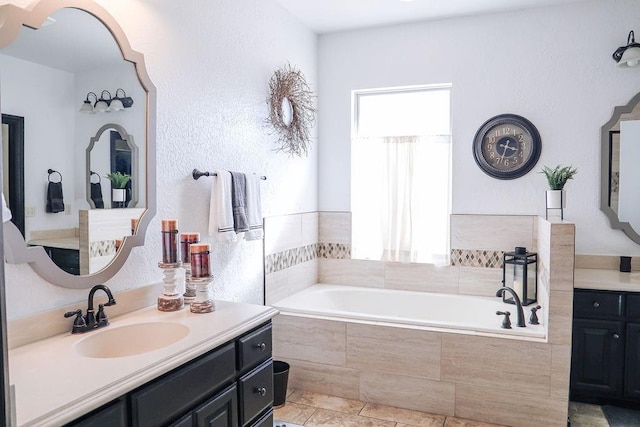 full bathroom featuring vanity and a bath