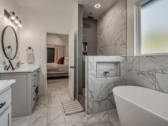 bathroom featuring a wealth of natural light, vanity, and shower with separate bathtub