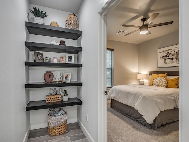 bedroom with ceiling fan and wood-type flooring