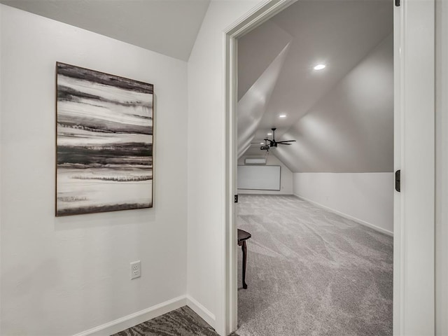 additional living space featuring carpet, ceiling fan, and lofted ceiling