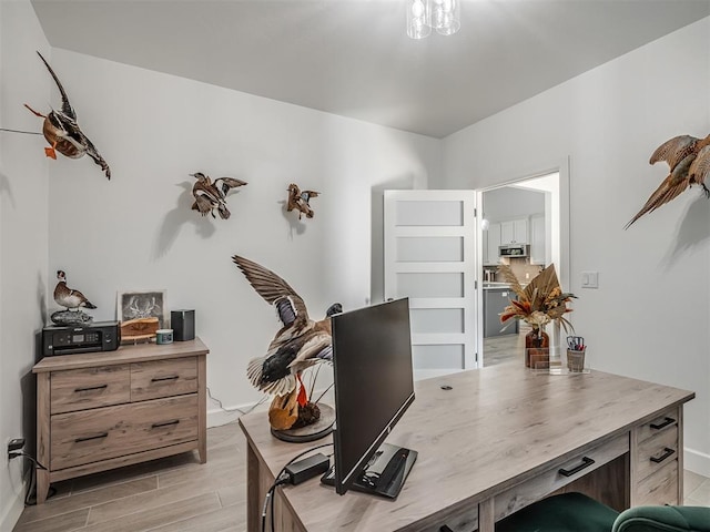 office space with light wood-type flooring