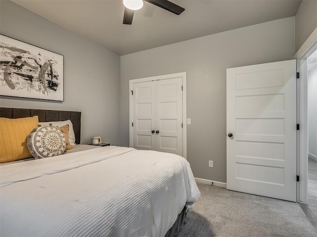 bedroom featuring ceiling fan, carpet floors, and a closet