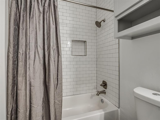 bathroom with shower / bath combination with curtain and toilet