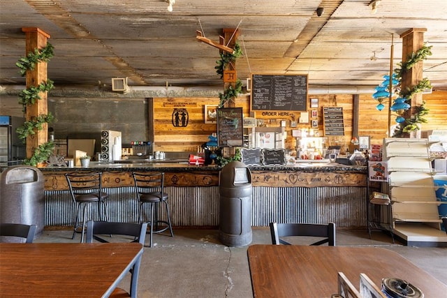 bar featuring concrete floors