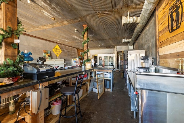 kitchen featuring wood walls