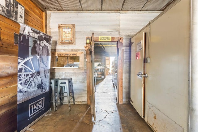 hallway with wooden walls