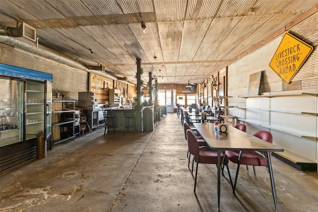 unfurnished dining area with concrete floors