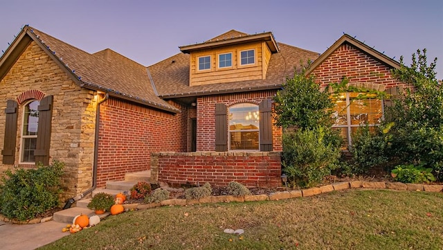 view of front of property with a yard