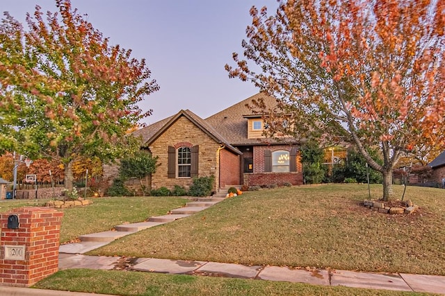 view of front of property with a lawn