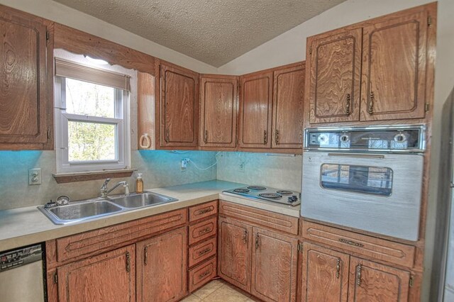 21351 E Tenth St, Hinton, OK 73047 - kitchen with white oven, dishwasher, a textured ceiling, light countertops, and electric cooktop
