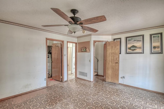 unfurnished bedroom with connected bathroom, ceiling fan, water heater, a textured ceiling, and ornamental molding