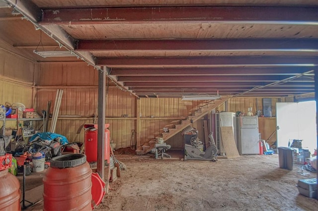 basement with white refrigerator