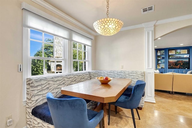 dining area with crown molding and breakfast area