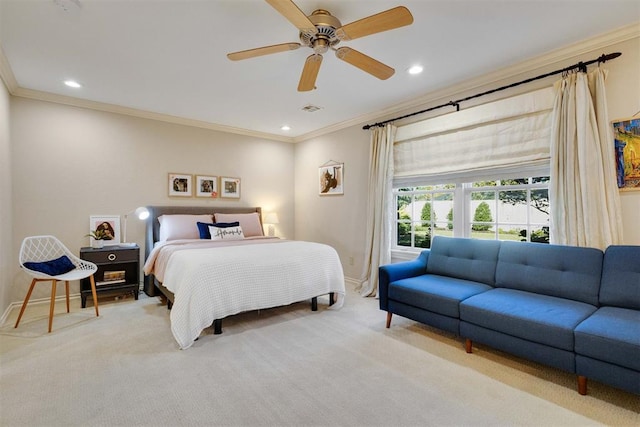 carpeted bedroom with ceiling fan and crown molding