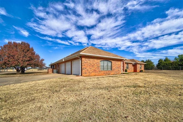 view of side of home featuring a garage