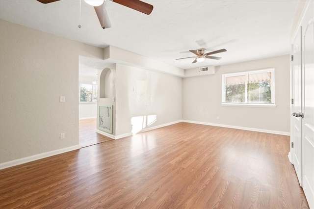 unfurnished room featuring ceiling fan and light hardwood / wood-style flooring