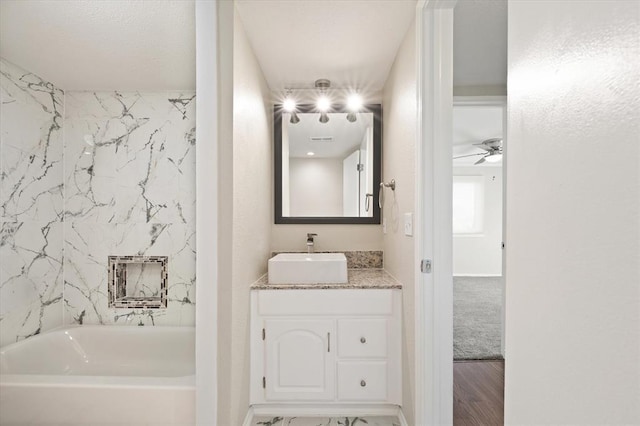 bathroom featuring ceiling fan, vanity, and hardwood / wood-style flooring