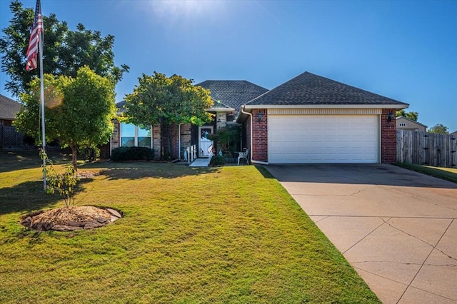 single story home featuring a front yard and a garage