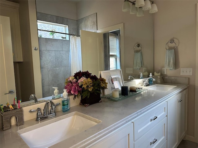 bathroom with a shower with shower curtain and vanity