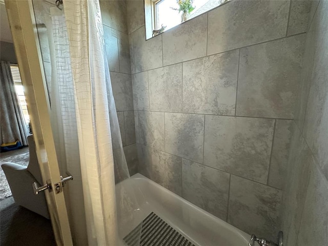 bathroom with shower / bathtub combination with curtain