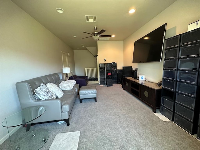 carpeted living room featuring ceiling fan