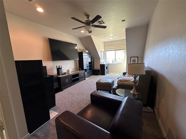 living room featuring ceiling fan and carpet