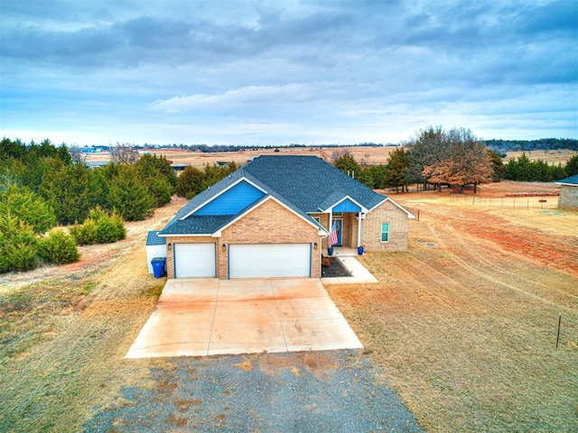 view of front of home featuring a rural view and a garage