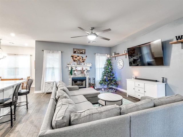 living room with hardwood / wood-style flooring and ceiling fan