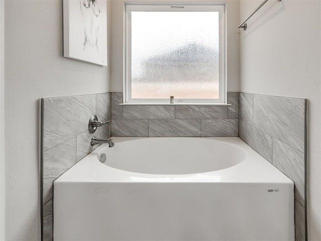 bathroom featuring a tub