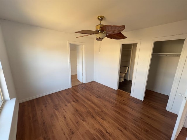 unfurnished bedroom with connected bathroom, ceiling fan, and dark hardwood / wood-style floors