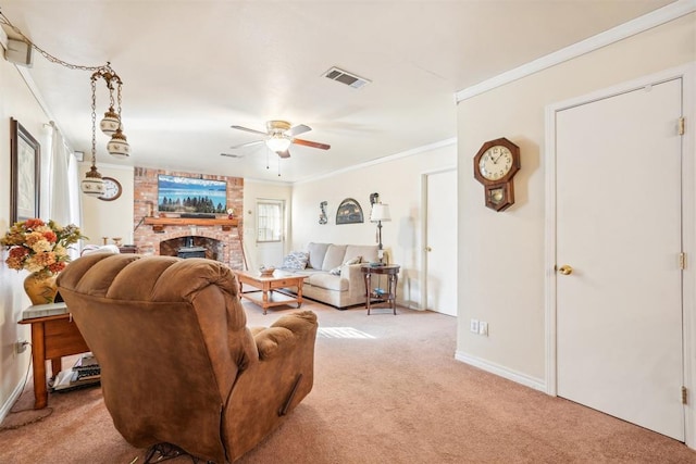 carpeted living room with ceiling fan, crown molding, and a brick fireplace