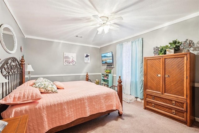 bedroom featuring light carpet, ceiling fan, and crown molding