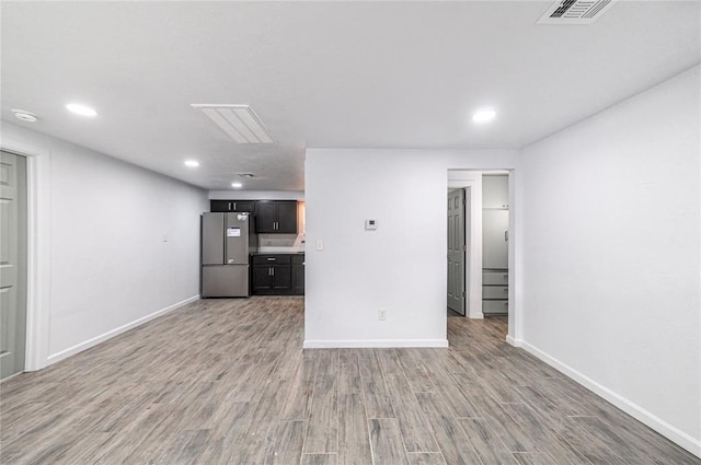 unfurnished living room featuring light hardwood / wood-style floors