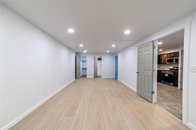 empty room with light hardwood / wood-style floors